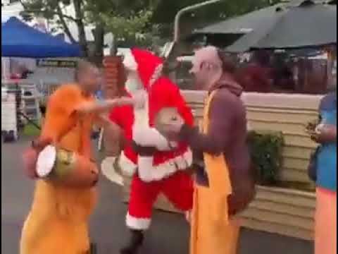 Teaching Santa Claus some Hare Rama Hare Krishna